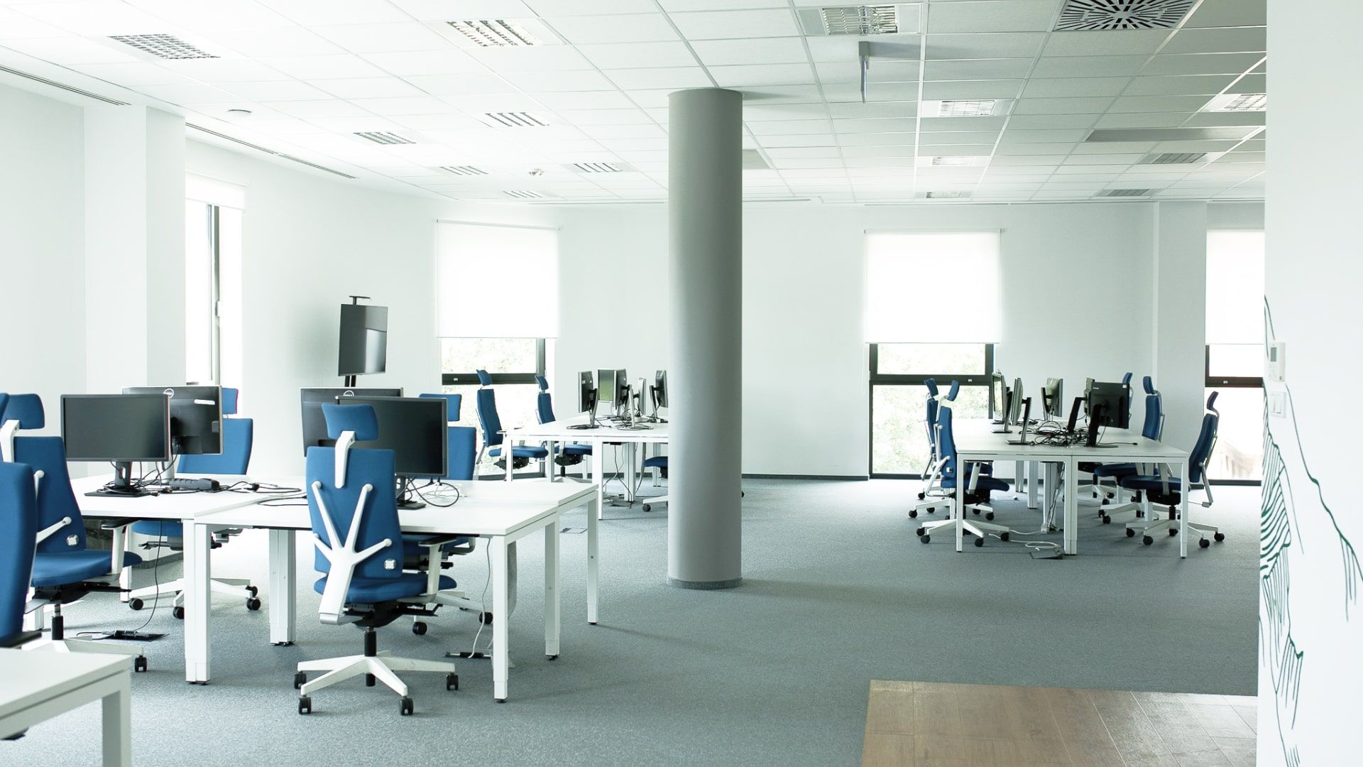 Office space with several desks and chairs